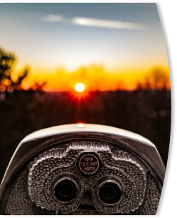 telescope looking into a sunset